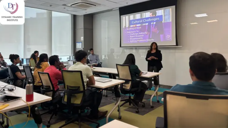 Tina Shah teaching a corporate workshop on cultural challenges, participants seated at desks