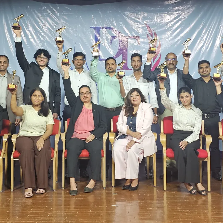 Dynamic Training Institute participants holding their trophies