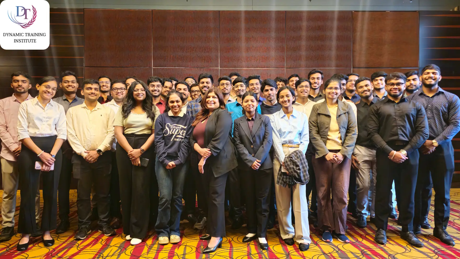 Group photo of a large batch of young professionals standing together