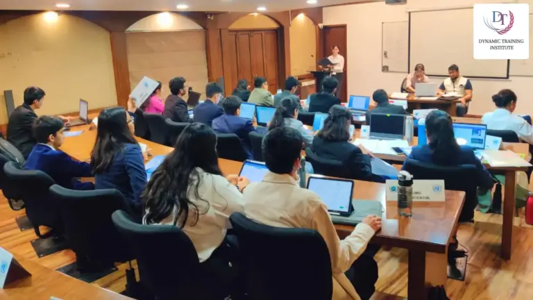 Students with laptops in a conference committee session