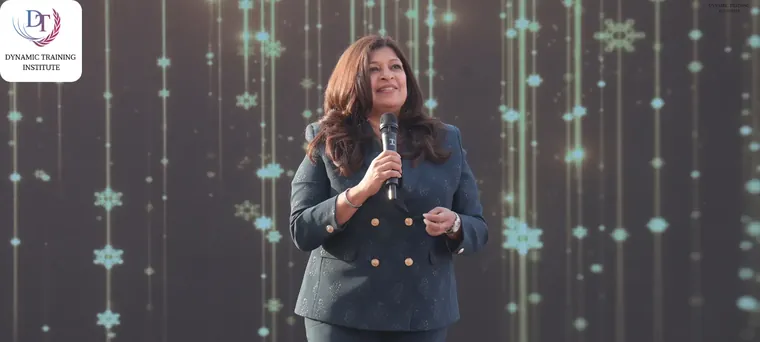 Tina Shah speaking on stage with a microphone