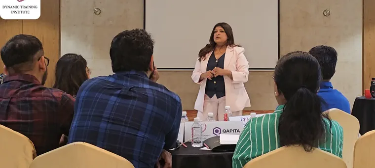 Tina Shah leading a training session for a seated group of professionals