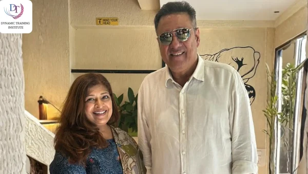 A woman and a man in sunglasses posing together indoors